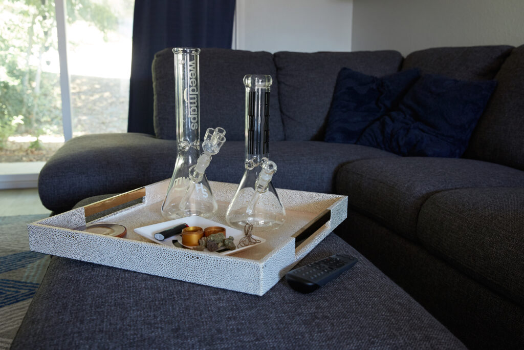 Twp bongs on tray on top of couch