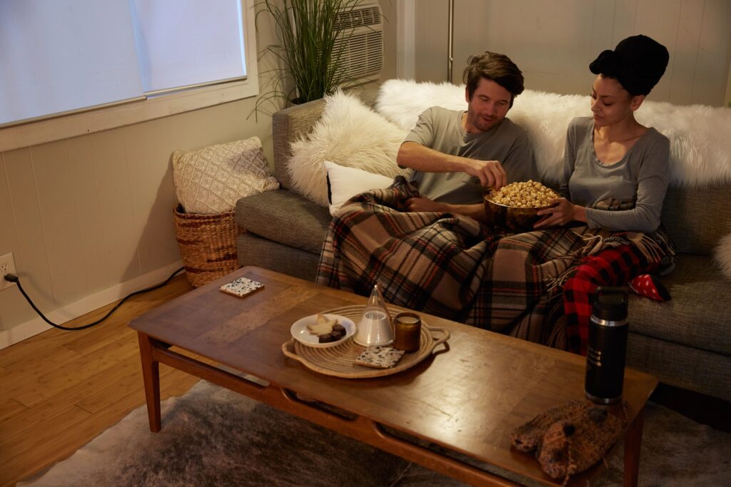 Couple on couch watching TV