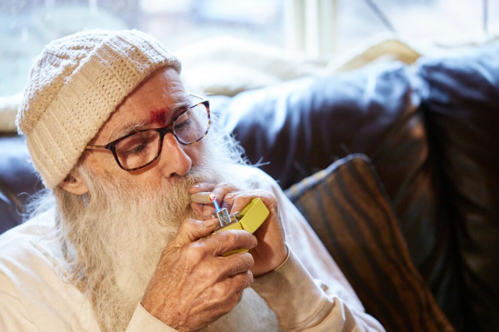 Swami smoking cannabis from his farm