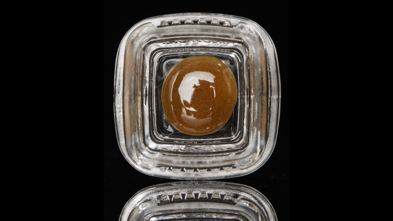 Click to see a larger version of the image Temple Ball concentrate in square glass jar on black background