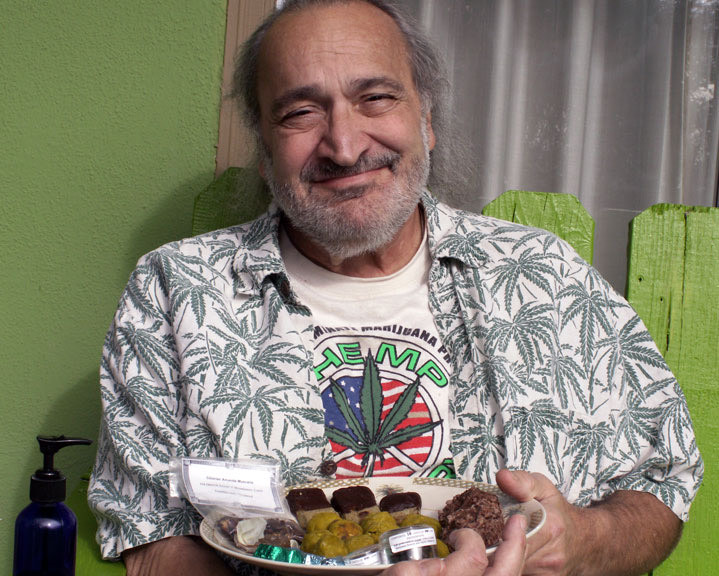 Click to see a larger version of the image Courtesy of Mary Schaefer — Jack Herer holding a plate of infused treats in Lake County, CA, 2008.