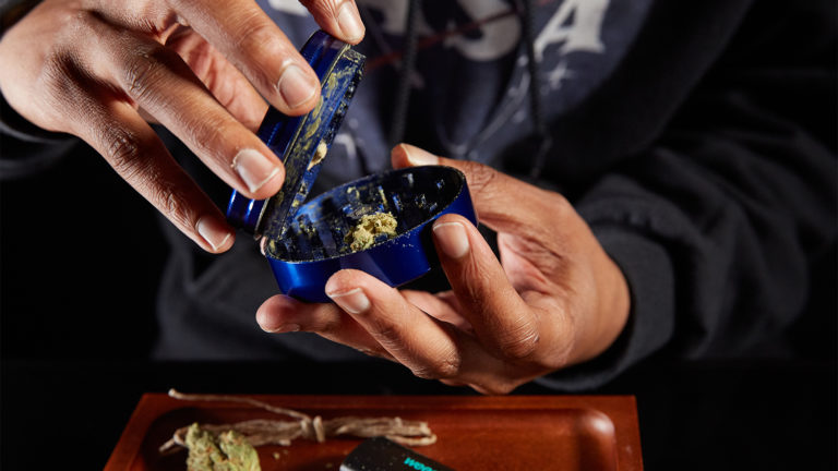 Click to see a larger version of the image grinding weed for use in bong