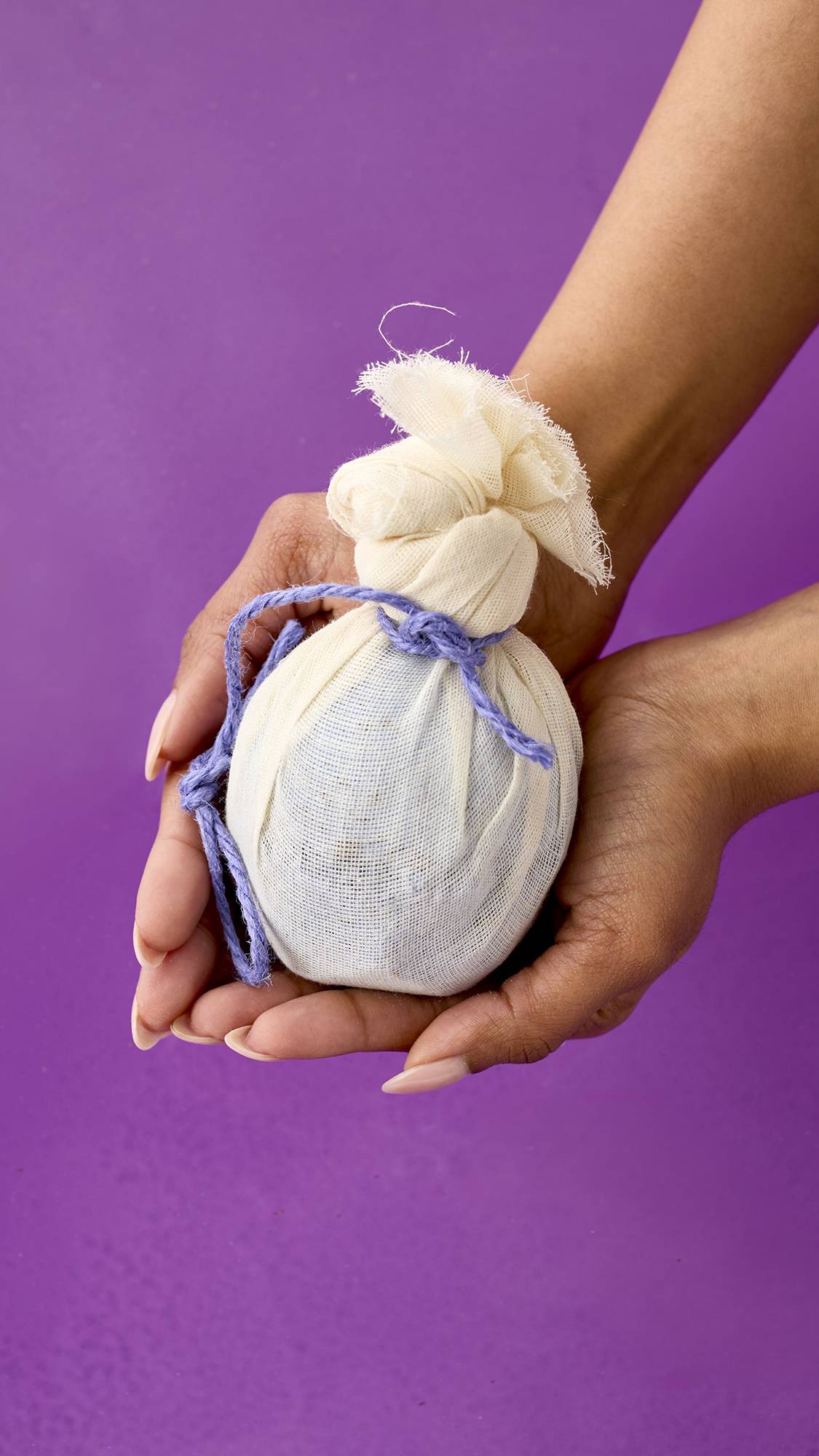 Lush Deep Sleep bath bomb in its muslin wrap.
